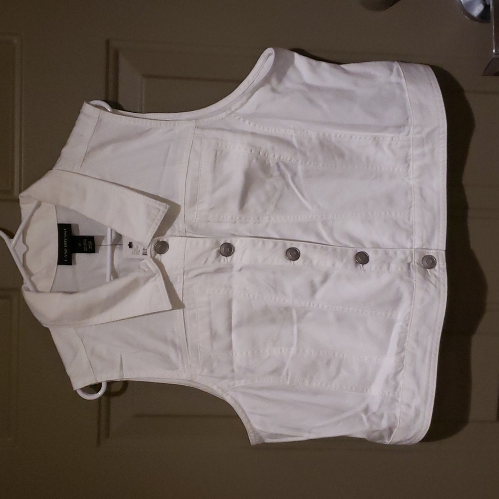 White denim vest.